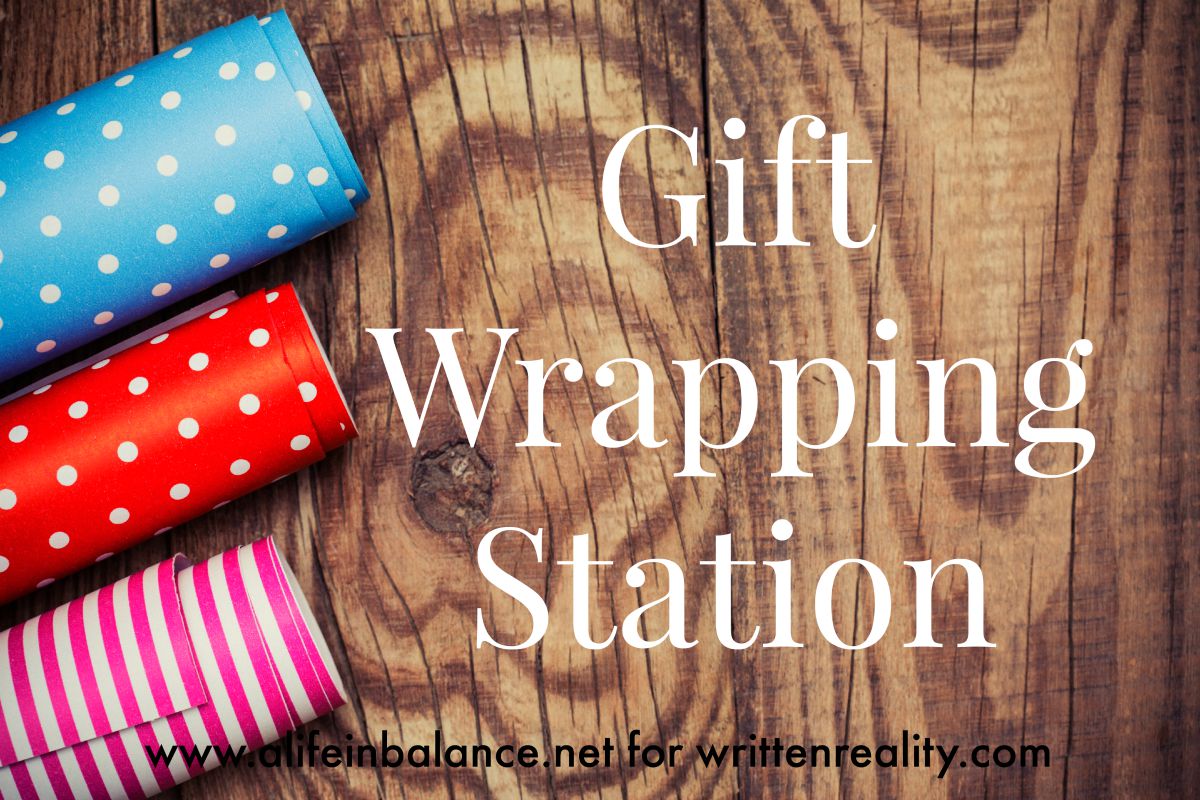 Scissors, Tape, Ribbon And Wrapping Paper On A Gift Box. Focus On